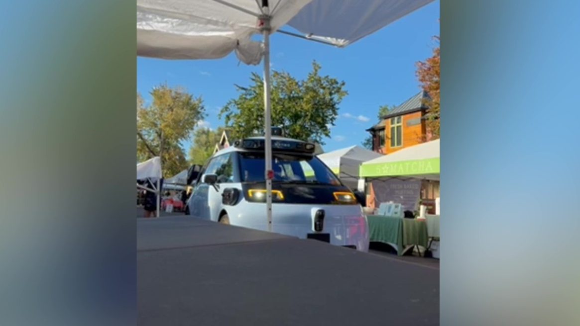 Waymo Robotaxi Rolls Through Denver Farmers Market During Setup